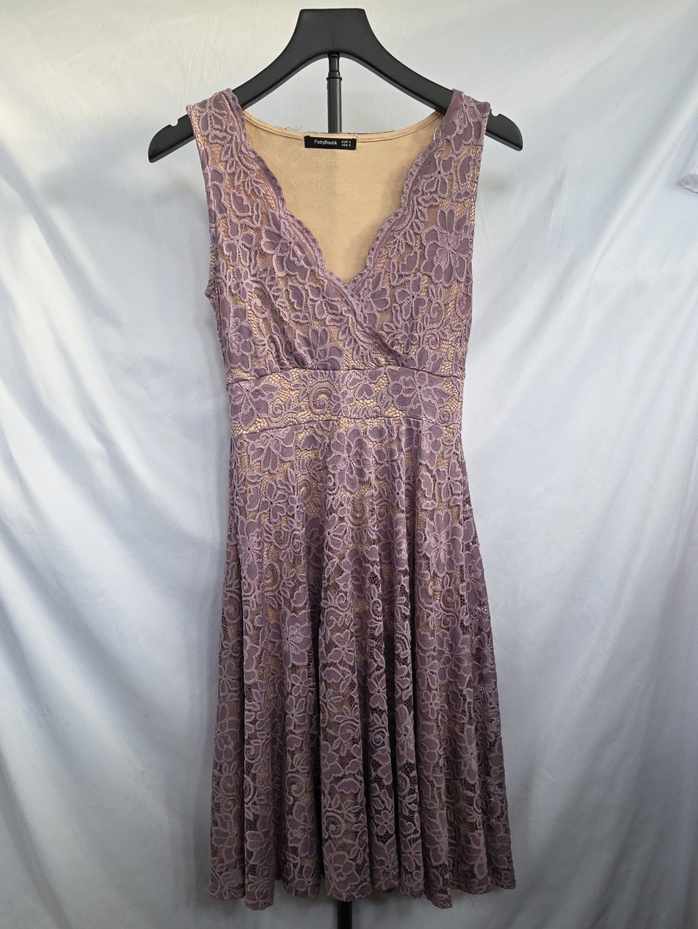 PattyBoutik Floral Lace Overlay Fit and Flare Dress in a lavender/purple shade.